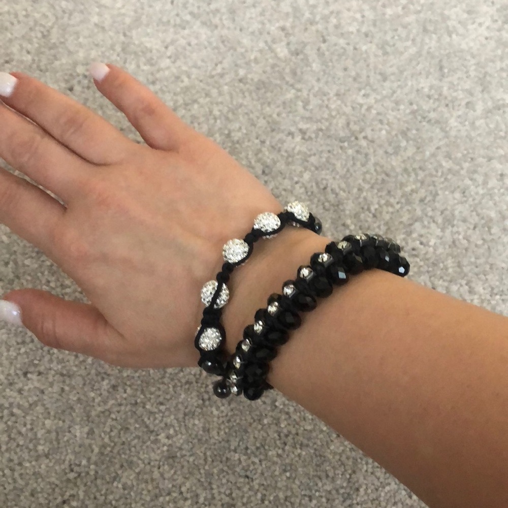 Two black and silver adjustable bracelets!